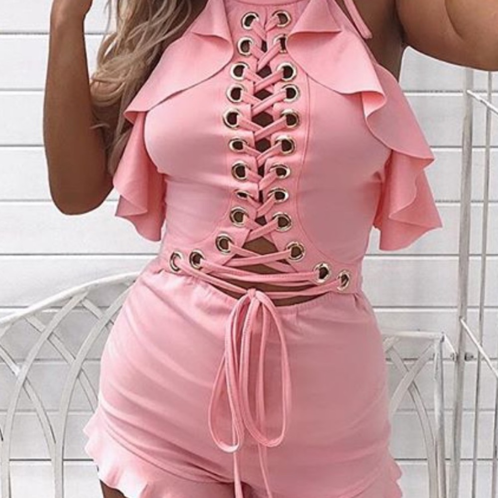 Pink romper ties up in the front and back